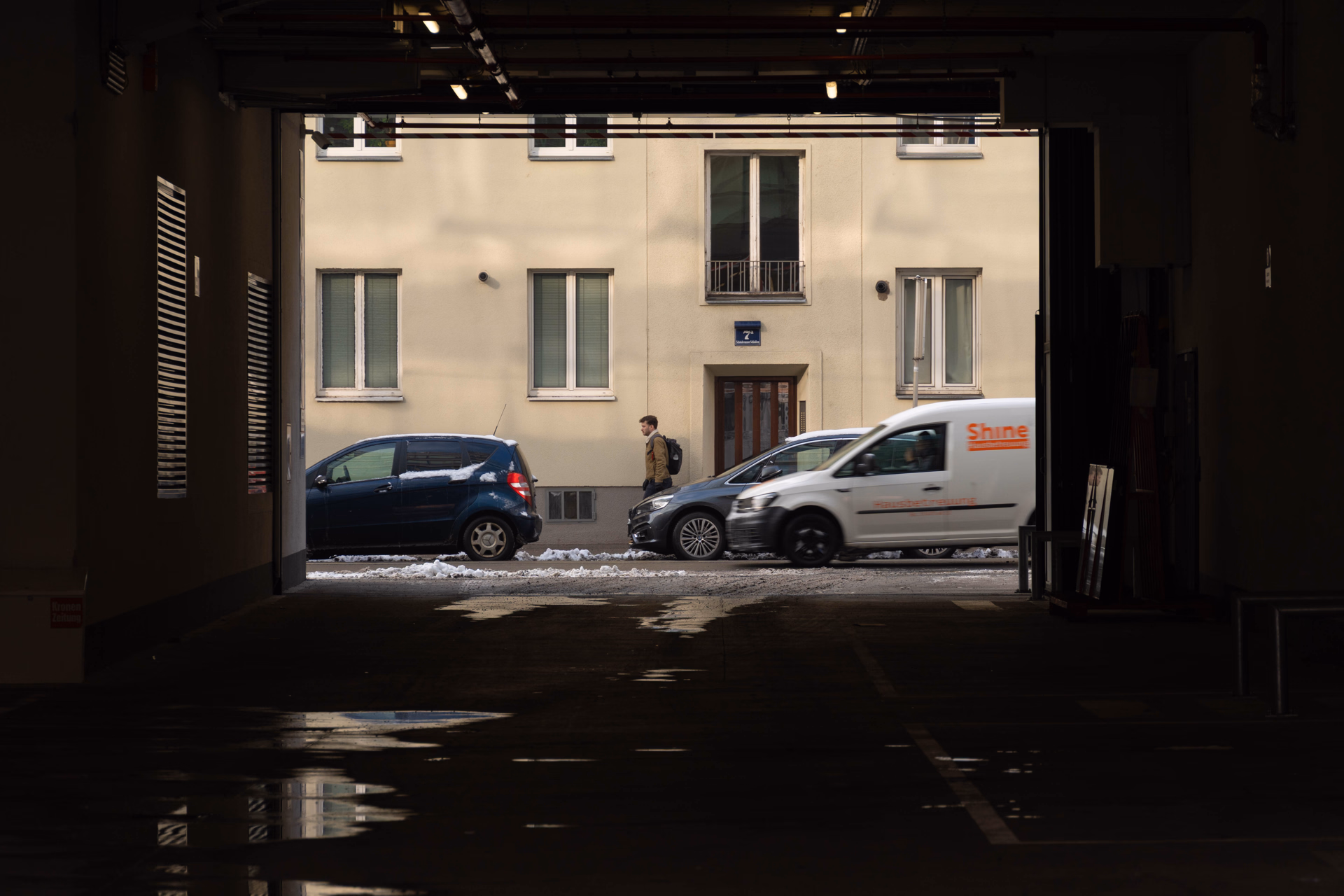 frame-in-frame photograph, through a dark builing